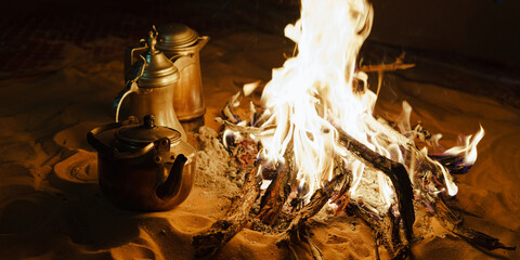 Arab Style Coffee, Tea and Water by a fire in the desert. 
