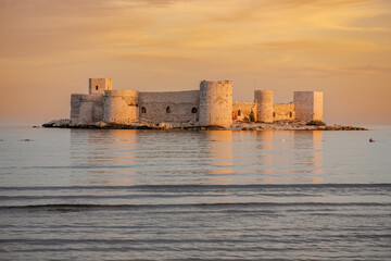 The impressive view of Maiden's Castle at sunset. The famous historical Maiden's Castle in the Erdemli district of Mersin, Turkey. Known as Kız Kalesi in Turkish.