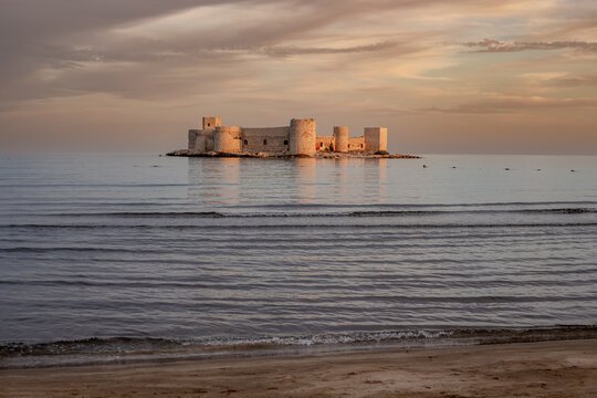 The impressive view of Maiden's Castle at sunset. The famous historical Maiden's Castle in the Erdemli district of Mersin, Turkey. Known as Kız Kalesi in Turkish.