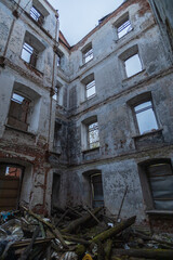 Dilapidated building with a lot of debris and rubble