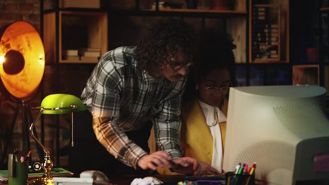 Nerdy IT guy helping woman with retro computer, troubleshooting program bugs