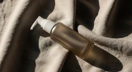 Amber Glass Bottle Surrounded by Fabric Textures