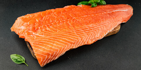 Salmon fillet raw red fish seafood dish natural tasty snack fresh delicious gourmet food background on the table rustic top view copy space pescetarian diet
