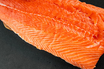 Salmon fillet raw red fish seafood dish natural tasty snack fresh delicious gourmet food background on the table rustic top view copy space pescetarian diet