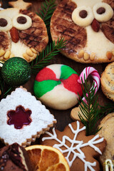 Sweet Christmas cookies on rustic table, top view