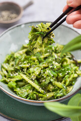 Asian style chuka wakame seaweed or sea mustard, cucumbers, green lettuce and sesame seeds fresh salad