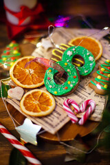 Christmas wreath chocolate cookies on holiday background, top view