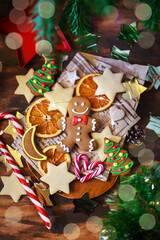 Gingerbread man Christmas cookies on holiday background, top view