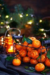 Fresh ripe tangerines with leaves on wooden table