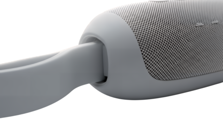 Close-up detailed view of a sleek gray portable audio speaker with a textured grille and durable carrying strap, expertly isolated on transparent background for professional product display