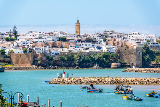 Rabat, Morocco – A scenic view of the Bou Regreg River with colorful fishing boats gently floating on the water