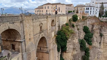 Ingelijste posters Ronda Puente Nuevo Close view of Puente Nuevo bridge and the gorge in Ronda, Spain  © Maria