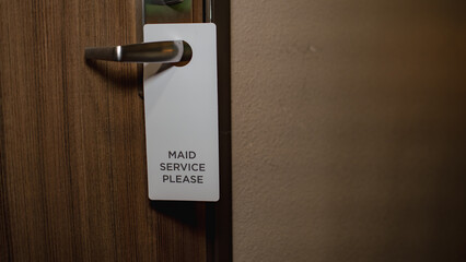"Maid Service Please" Door Tag on Hotel Room Door