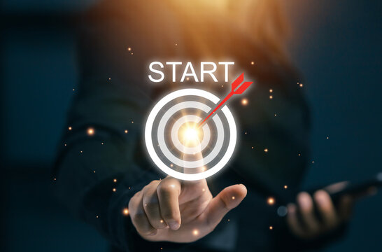 Finger touching start target icon with arrow hitting the center. Concept of goal setting, motivation, business start, and achieving success in digital marketing.