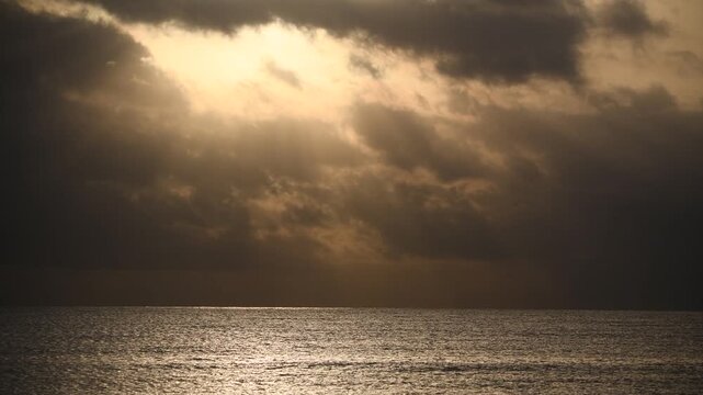 Seascape with dark storm clouds and rough sea currents, El Nino event