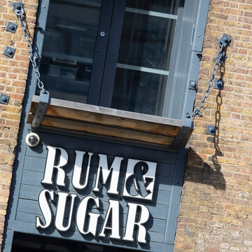 LONDON, UK - APRIL 05, 2018:  Sign outside Rum and Sugar Bar in West India Quay