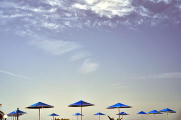 Beach umbrellas in Stavros on island of Crete, Greece