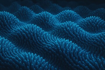 An abstract, close-up view of a dark blue, textured surface in a wave pattern.