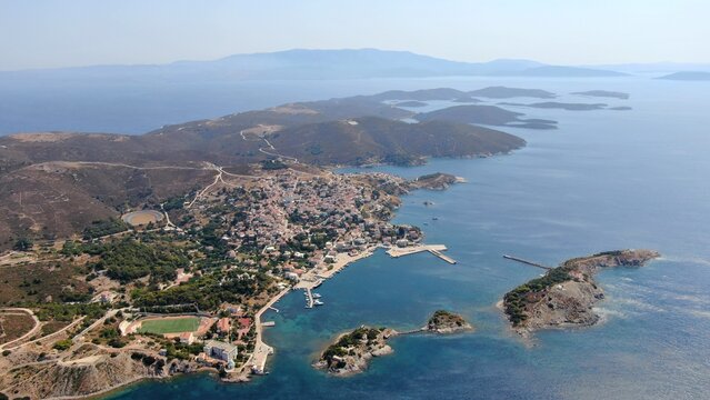 Aerial drone view of the Oinousses island complex east of Chios, Greece. Crystal-clear Aegean waters, scattered islets, rugged coastline and iconic maritime scenery. High-resolution Mediterranean land