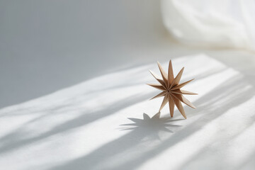 beautifully crafted wooden christmas star sits elegantly against clean white background