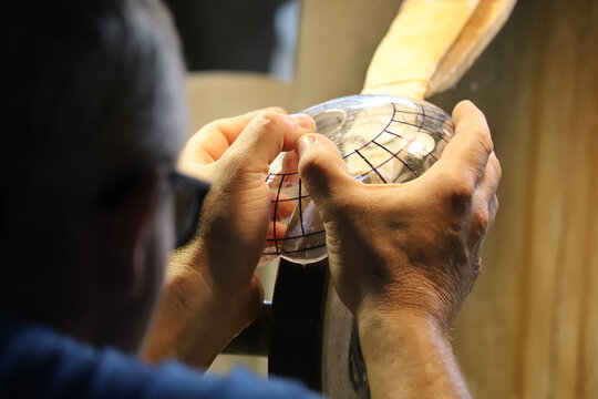 Lead glass grinding - grinder at work - Powered by Adobe