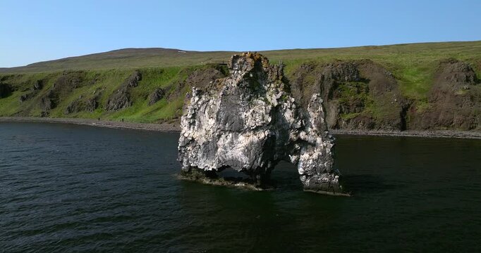 Stunning drone footage showcasing Hv&iacute;tserkur, the iconic basalt sea stack on Iceland&rsquo;s Vatnsnes Peninsula, rising majestically from the Atlantic and surrounded by breathtaking coastal landscapes