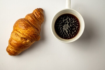 Croissant and Coffee on White Background