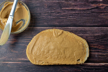Peanut butter on bread slice