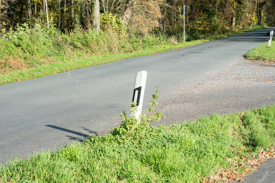 Country road marker post at an intersection