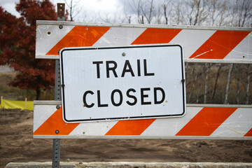 sign and barrier indicates that a trail is closed due to construction or maintenance, and no entry is allowed. parks and recreation design element. © mailcaroline