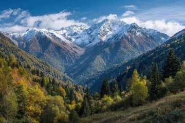 Majestic snowy peaks towering above lush green and golden forests, showcasing vibrant autumn hues against a clear blue sky with soft clouds, evoking tranquility and nature's grandeur