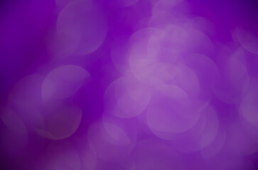 Purple  glow. Abstract background. Light and bokeh. Bright festive background.