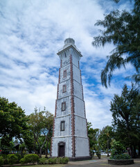 Beautiful  Pointe Vénus lighthouse surrounded by whispy clouds in the morning light © RovingPhoto