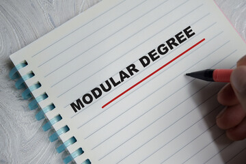 Concept of modular degree write on book isolated on Wooden Table.