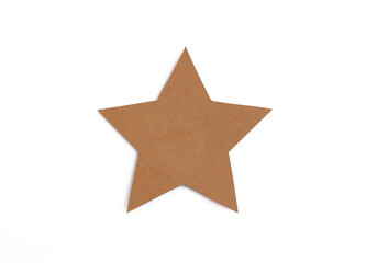 Blank brown star shape cut from recycled cardboard isolated on white background