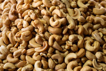 Roasted Cashew Nuts on Market Stall. Fresh Roasted Cashews for Sale at Local Market. Pile of Roasted Cashews at Farmers Market.