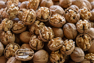 Organic walnuts for sale at street market. Close-up of walnuts in traditional market. Fresh shelled walnuts on market stall.