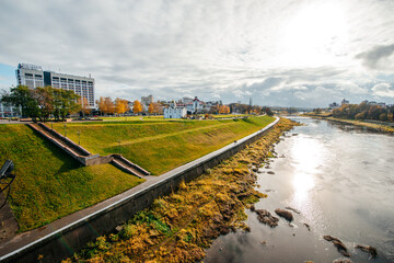 the embankment of the Western Dvina River in autumn, where people walk in Vitebsk, Belarus