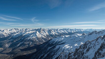 Snow-capped mountain range under a clear blue sky.