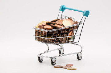 The Value of Spare Change: Miniature Shopping Cart Full of Mixed Euro Coins on a Bright White Background