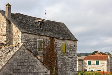 Rustic Stone Building With Green Shutters Overlooking Garden And Clear Blue Sky, Grohote, Solta