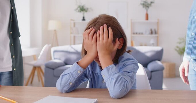 Family conflict, angry adult mother, father scolding lazy teen son for bad school results at home, frustrated parents talking to upset teenage boy arguing, parent and children problem communication