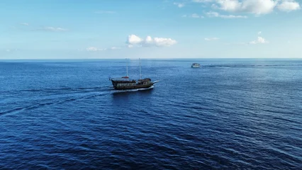 Fotobehang Schip Scenic view of a ship at the ocean  © Maximilian