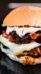 Juicy burger with special rub, melted cheese, onion chutney, and crispy bacon. Perfectly cooked and succulent, ideal for gourmet meals and promotions.