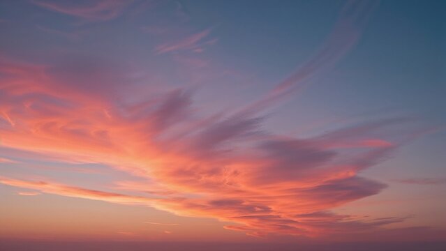 Vivid sunset sky with pink and purple clouds during evening.