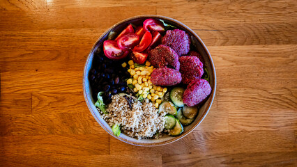 Vibrant Vegan Buddha Bowl with Quinoa, Falafel, and Fresh Vegetables