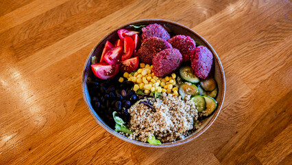 Vibrant Vegan Buddha Bowl with Quinoa, Falafel, and Fresh Vegetables
