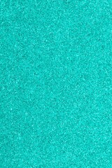 cyan light blue glitter background in vertical orientation ideal as a very sparkling wallpaper