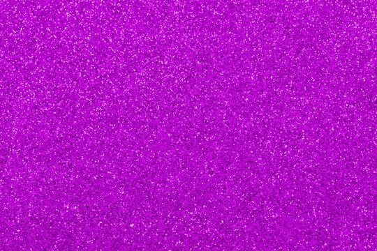 purple fuchsia glitter background in horizontal orientation ideal as a very sparkling wallpaper