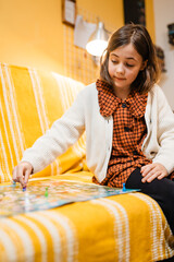 Happy father and child playing board game at home - happiness and family concept.